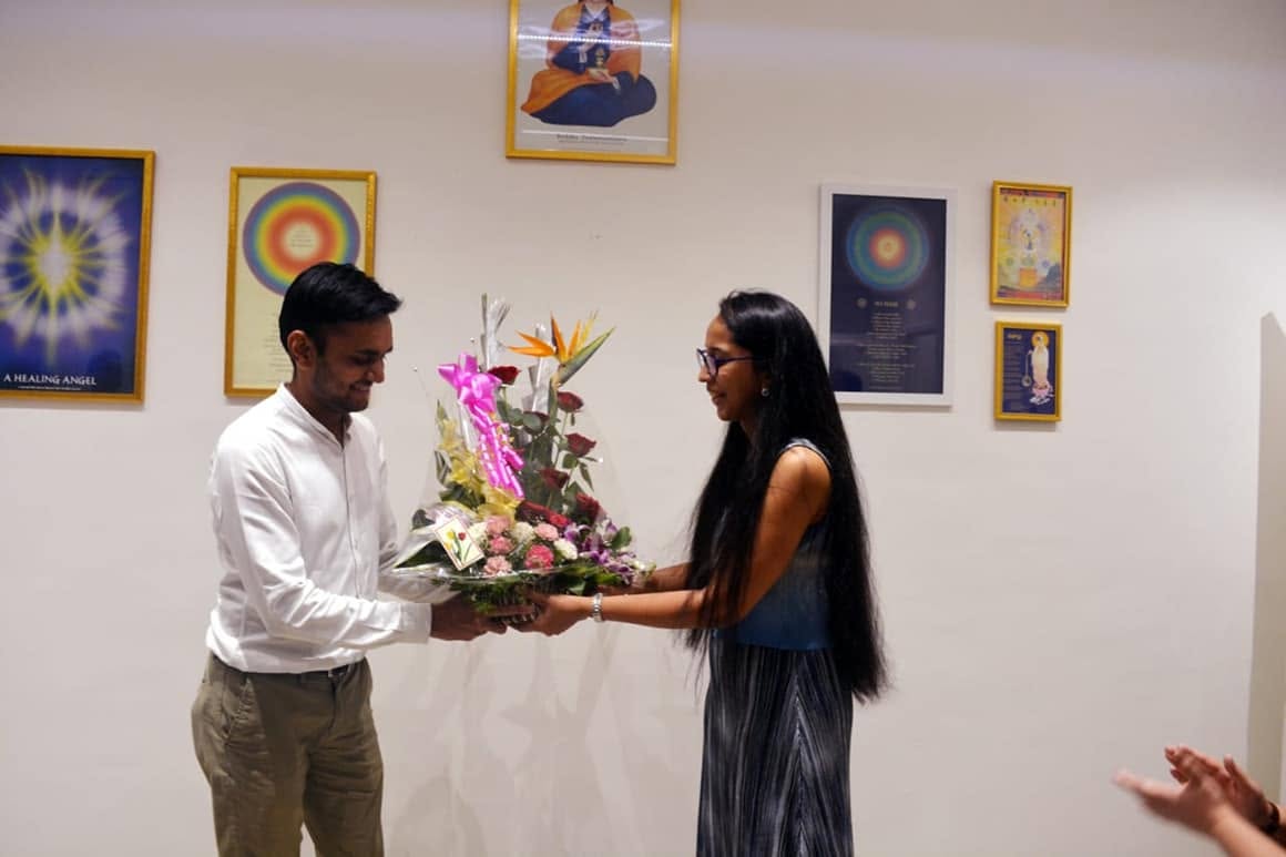 Flowers being presented at the center during a felicitation in 2018